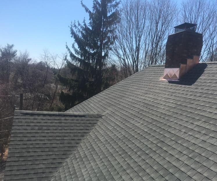 gray asphalt asphalt shingles and chimney with new flashing in connecticut
