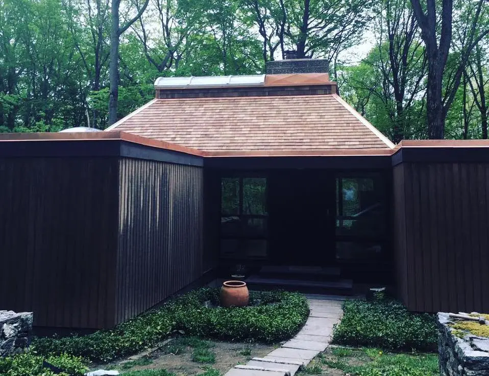 new cedar shake roof on a house in nature in connecticut